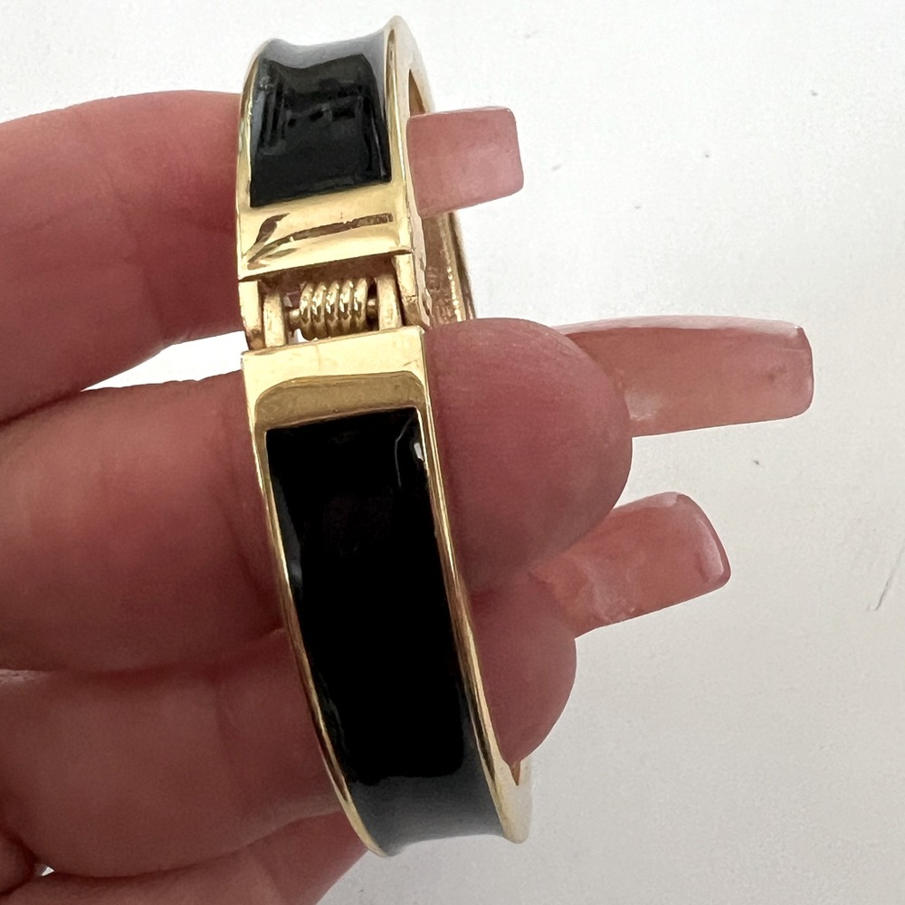 Black and gold costume hinged bracelet